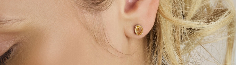 Zilveren sieraden met gele steen